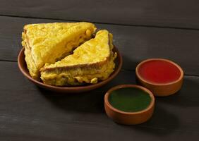 Indian Fried Snack Bread Pakora or Bread Bhaji Served with Tomato Ketchup, Green Chutney it is Made From Bread Slices photo