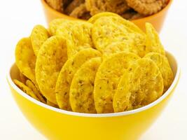 Indian Street Snack Food Masala Khari Papdi with Chakli on White Background photo