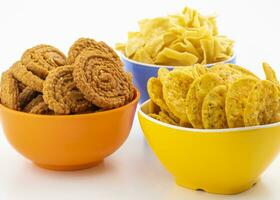 Indian Street Snack Food Masala Khari Papdi with Chakli or Besan Papdi on White Background photo