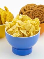 Indian Street Snack Food Besan Papdi With Masala Khari Papdi or Chakli on White Background photo