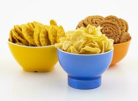 Indian Street Snack Food Besan Papdi With Masala Khari Papdi or Chakli on White Background photo