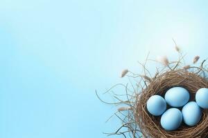 AI generated Easter eggs in a nest on a blue background photo