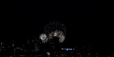 Fireworks display on dark sky photo