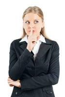 Businesswoman  with finger on her lips photo