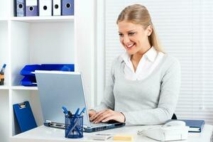 Businesswoman using laptop photo