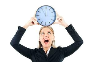 Businesswoman shouting and holding clock photo