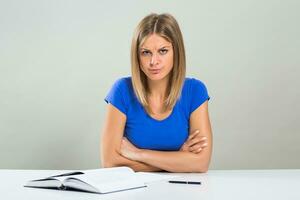 Female student is very angry because she has to study. photo