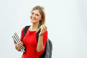 Happy student with books and apple photo