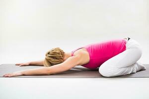 Woman exercising yoga indoor photo