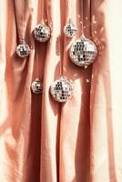 Sparkling disco balls 80s retro decoration. New Year holidays concept. photo