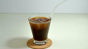 black iced coffee in a transparent glass photo