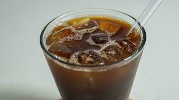 black iced coffee in a transparent glass photo