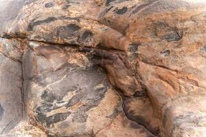 Natural Stone Boulder Surface Texture with Wild and Rough Appearance photo
