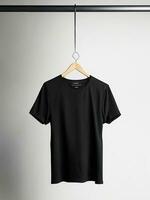 AI generated A black t shirt is hanging on a hanger with the word on it Ai generated photo