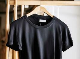 AI generated A black t shirt is hanging on a hanger with the word on it Ai generated photo