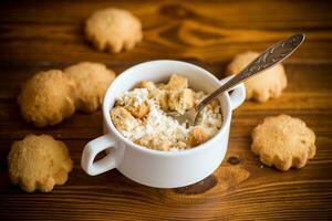 Homemade cottage cheese with pieces of shortbread cookies for breakfast photo