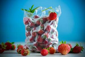frozen fresh strawberries in a vacuum bag photo