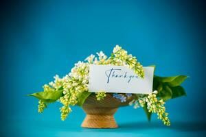 bouquet of white lilacs with greeting card photo