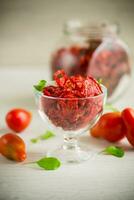 a handful of dried tomatoes and fresh tomatoes photo