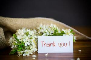 thank you card and blooming spring branch with flowers photo