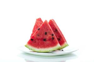 pieces of fresh ripe red watermelon on white photo