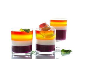 lot of colored sweet fruit jelly in a glass photo