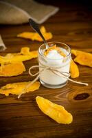 homemade sweet yogurt in a glass with mango photo