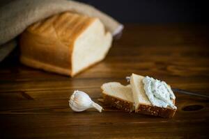 homemade salted curd spread with herbs and garlic photo