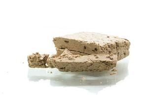 piece of sweet halva on white background photo