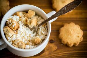 Homemade cottage cheese with pieces of shortbread cookies for breakfast photo