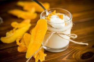 homemade sweet yogurt in a glass with mango photo