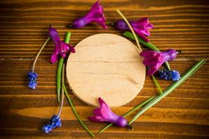 beautiful bouquet of spring flowers on a wooden table photo