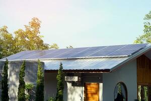 A solar roof system in a building that installs solar panels on the roof of the building. To generate electricity, which will save electricity and reduce global warming. photo