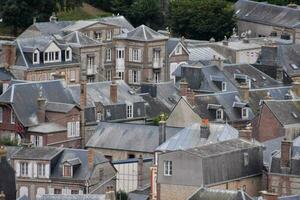 a view of the roofs of a town photo