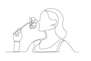 A woman smells flowers vector