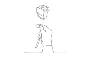 A hand holding a beautiful rose vector