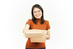 Holding Package Box or Cardboard Box and Give it To You Of Beautiful Asian Woman Isolated On White Background photo