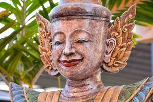 a statue of a buddha with a smile photo