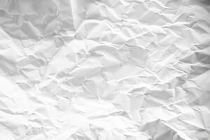 white and gray crumpled paper texture background. crush paper so that it becomes creased and wrinkled. photo