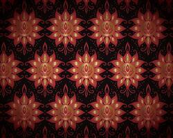 Symmetrical Red and Gold Mandala Flowers on a Black Background vector