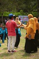Magelang,Indonesia,12 07 2023.outdoor teaching and learning activities for young children, interaction with nature and teachers using play methods. photo