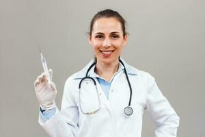 Female doctor  holding injection. photo