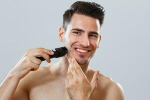 Man shaving beard photo