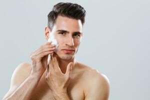 Man cleaning his face photo