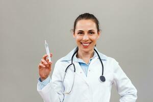 Female doctor  holding injection. photo