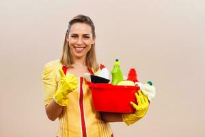 Portrait of happy housewife showing thumb up photo