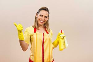 Portrait of happy housewife showing thumb up photo