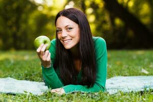 Woman eating apple photo