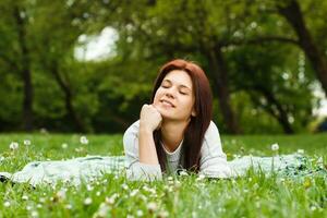 Young woman enjoys spending time in nature photo