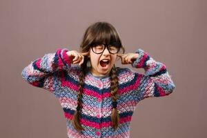 Furious little nerdy girl doesn't want to listen photo